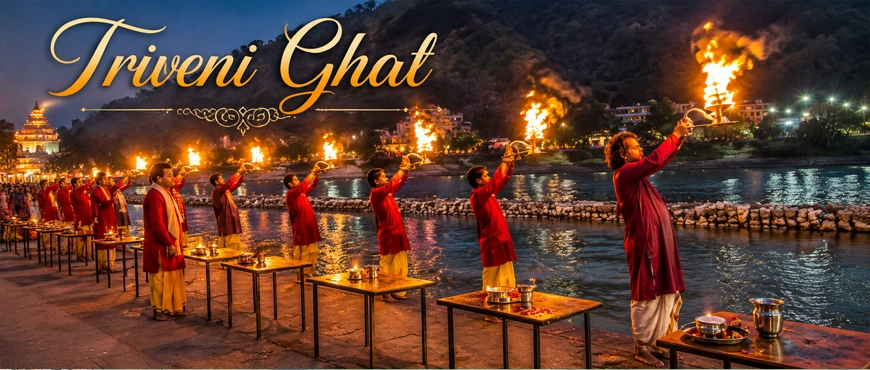 Triveni Sangam Ghat in Rishikesh with devotees performing the evening Ganga Aarti during a spiritual visit by Delhi to Rishikesh Tempo Traveller on Rent.
