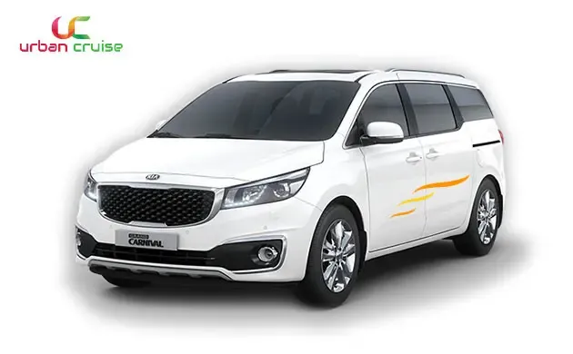 a white coloured 7 seater kia carnival on rent in mumbai